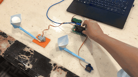 pass a ball using a cup attached to the end of servos