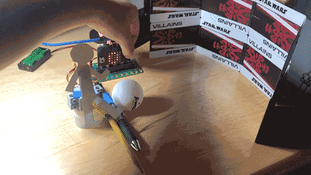 cardboard player kicks soccer ball into goal using servo motor to move leg